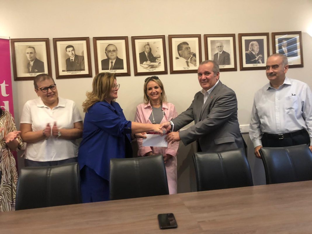 The GWU with a donation to the Marigold Foundation